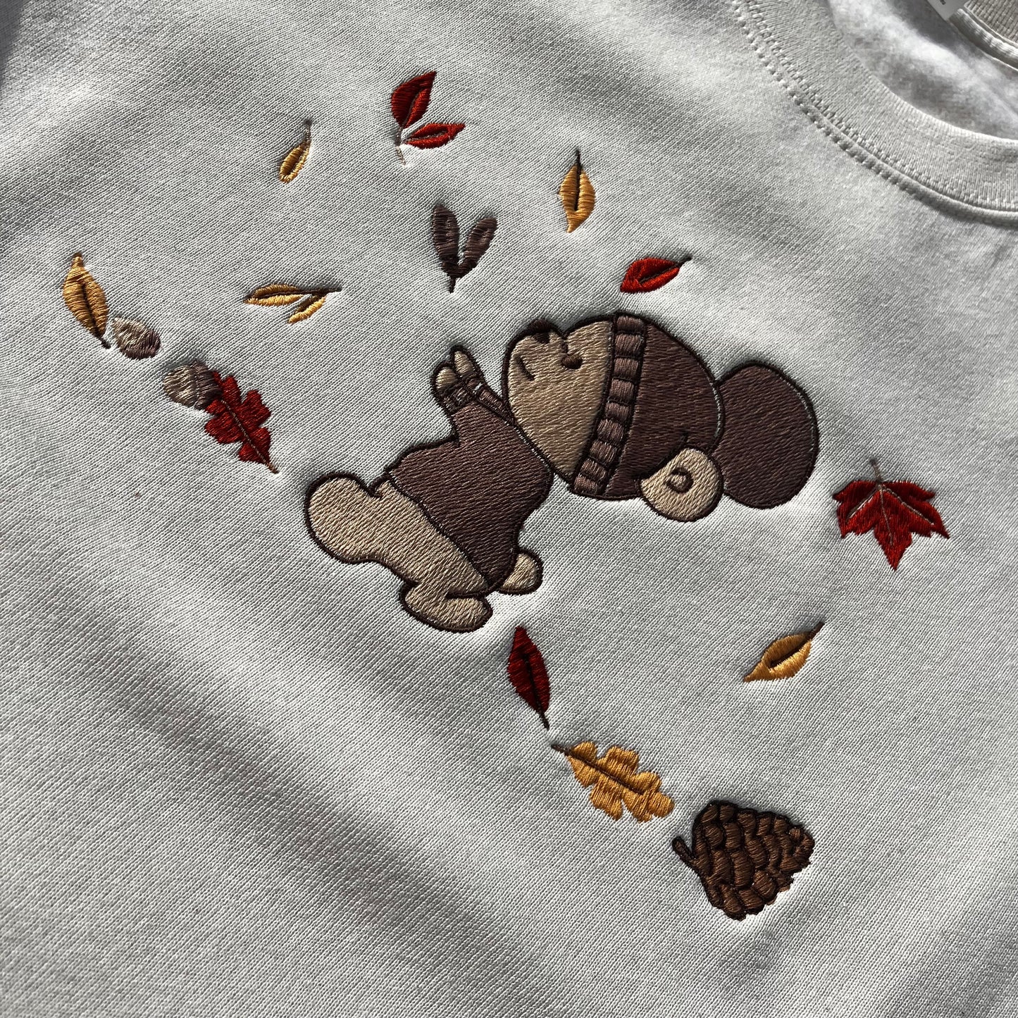 SWEAT-SHIRT "OURSON DANS LES FEUILLES"